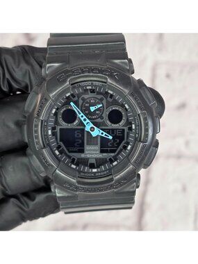 Casio G-Shock GA100C 5081 Watch Black Digital & Blue Hands Shock Water Resistant